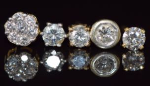 Three 18ct gold earrings each set with a diamond of approximately 0.2ct, an 18ct gold earring set