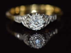 An 18ct gold ring set with an old cut diamond in a platinum setting, 2.3g, size L