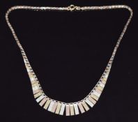 A 9ct gold tri-coloured Cleopatra style necklace, 7g, 40cm long
