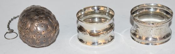 Two hallmarked silver napkin rings and a sterling silver tea infuser, weight of all three 62g
