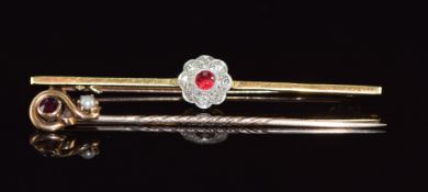 A c1925 15ct gold brooch set with a round cut spinel and diamonds in a platinum setting together