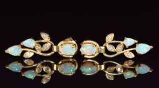 A pair of 14ct gold earrings set with opals and diamonds, 3.9g, 2.6cm