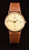 Rotary 9ct gold gentleman's wristwatch with date aperture, gold hands and hour markers, champagne