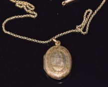 Victorian locket with fern, Greek key and shield decoration, 2.4 x 1.8cm, on 9ct gold chain, 3.4g