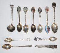 Silver souvenir spoons, many being 800 grade, together with a hallmarked silver owl bookmark, weight