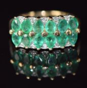 A 9ct gold ring set with pear cut emeralds and diamonds, 3.5g, size J