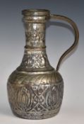 A 19th/20thC Arts & Crafts style ewer with hammered decoration, height 31cm