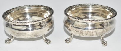 Pair of Georgian silver open salts, raised on ball and claw feet, marks indistinct, diameter 7.