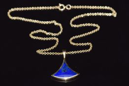 A 9ct gold pendant set with lapis lazuli on 9ct gold chain, pendant 2cm and chain 40cm long, 6.3g