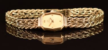 Omega 9ct gold ladies wristwatch with gold hands and dial, and signed quartz movement, on 9ct gold