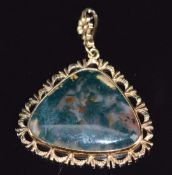 A 9ct gold pendant set with moss agate cabochon, 3.8 x 3.5cm, 10.3g