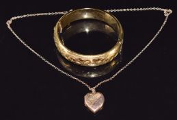 A rolled gold bangle and a 9ct gold chain (1.8g) with 9ct gold back and front locket
