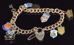 A 9ct gold curb link bracelet with seven silver charms and two 9ct gold, total weight 25.9g, 20cm