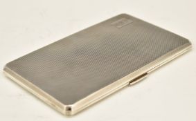 Art Deco style hallmarked silver cigarette case with engine turned decoration and gilt interior,