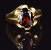 A 9ct gold ring set with an oval cut garnet, 4g, size O