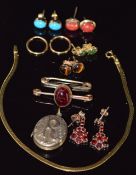 A 9ct gold bracelet, four pairs of 9ct gold earrings set with coral, tiger's eye, turquoise and