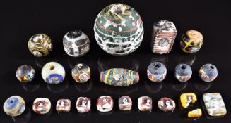 A collection of 19thC and earlier Venetian glass face beads, largest 5cm