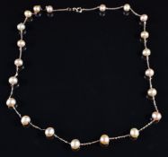 A 14k rose gold necklace set with pearls, 6.6g, 44cm long