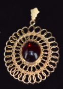 A 14ct gold pendant set with a red glass cabochon, 3 x 2.7cm, 3.4g