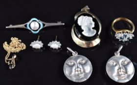 A silver brooch set with enamel and pearl, silver pendant set with a cameo, earrings set with opals,