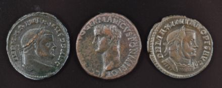 Three Roman Imperial bronze coins comprising Caligula Ae As 37-38AD and two Follis of Maximianus