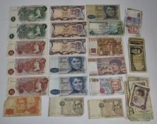 A quantity of world banknotes, largely pre Euro holiday change, together with clean UK examples