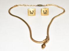 A snake/ serpent necklace and a pair of cufflinks