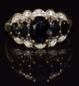 A 9ct gold ring set with sapphires and diamonds, 4.2g, size N