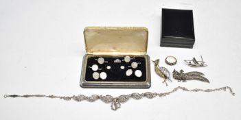 A 9ct gold ring set with paste, a boxed set of cufflinks and studs set with mother of pearl,