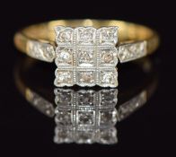 An 18ct gold ring set with diamonds in a square platinum setting, 2.7g, size L