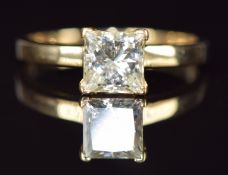 An 18ct gold ring set with a princess cut diamond of approximately 1ct, 2.6g, size L