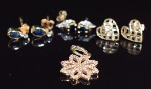 A 14k gold pendant set with diamonds (2.4g), two pairs of 9ct gold earrings set with sapphires and