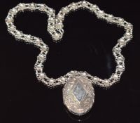 Victorian silver locket on Victorian silver necklace made up of floral links, 55.7g