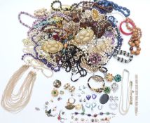 A collection of costume jewellery including silver earrings set with opals, silver brooch, white