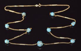 An 18ct gold necklace set with Venetian glass beads, 78cm long, 23g