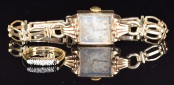 A 9ct gold cased ladies watch and an 18ct gold ring set with diamonds, 2.1g