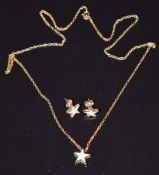 A 9ct gold star pendant set with diamonds on 9ct gold chain, with matching earrings, 2.2g