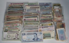 A large collection of Asian banknotes including India, Iraq, Iran, Pakistan, Vietnam, Indonesia,