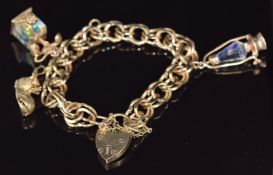 A 9ct gold charm bracelet made up of double links with three 9ct gold charms and heart padlock