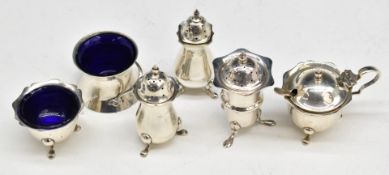 Hallmarked silver salts, mustard and peppers, including an Art Nouveau example with twisting
