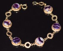 A 9ct gold bracelet set with Blue John cabochons, 10.6g, 18cm long