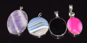 Four silver pendants set with agate