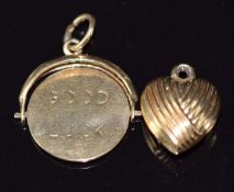 Two 9ct gold charms / pendants, one in the form of a heart the other 'good luck', 1.5g