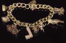 A 9ct gold charm bracelet with eight 9ct gold charms including train, kookaburra, cherub, etc, 81.