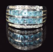 A 9ct white gold ring set with blue topaz and diamonds, 6.1g, size U
