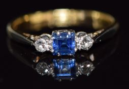 An 18ct gold ring set with a sapphire and diamonds, 1.8g, size L