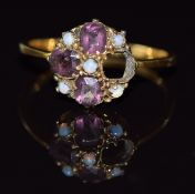 An 18ct gold ring set with amethysts and opals, 2.3g, size O/P