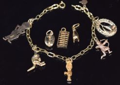 A 9ct gold charm bracelet with five 9ct gold and three 14ct gold charms, 16.4g, 19cm long