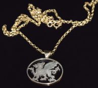 A 9ct gold pendant in the form of the Welsh Dragon, 2.5 x 2cm, on 9ct gold chain, 44cm, 6.3g