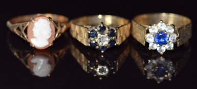 Three 9ct gold rings, one set with a diamond and sapphires, one a cameo and one paste, 7.4g